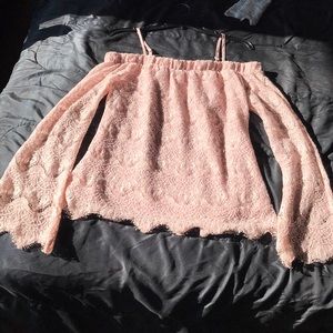 A soft pink off the shoulder shirt/blouse